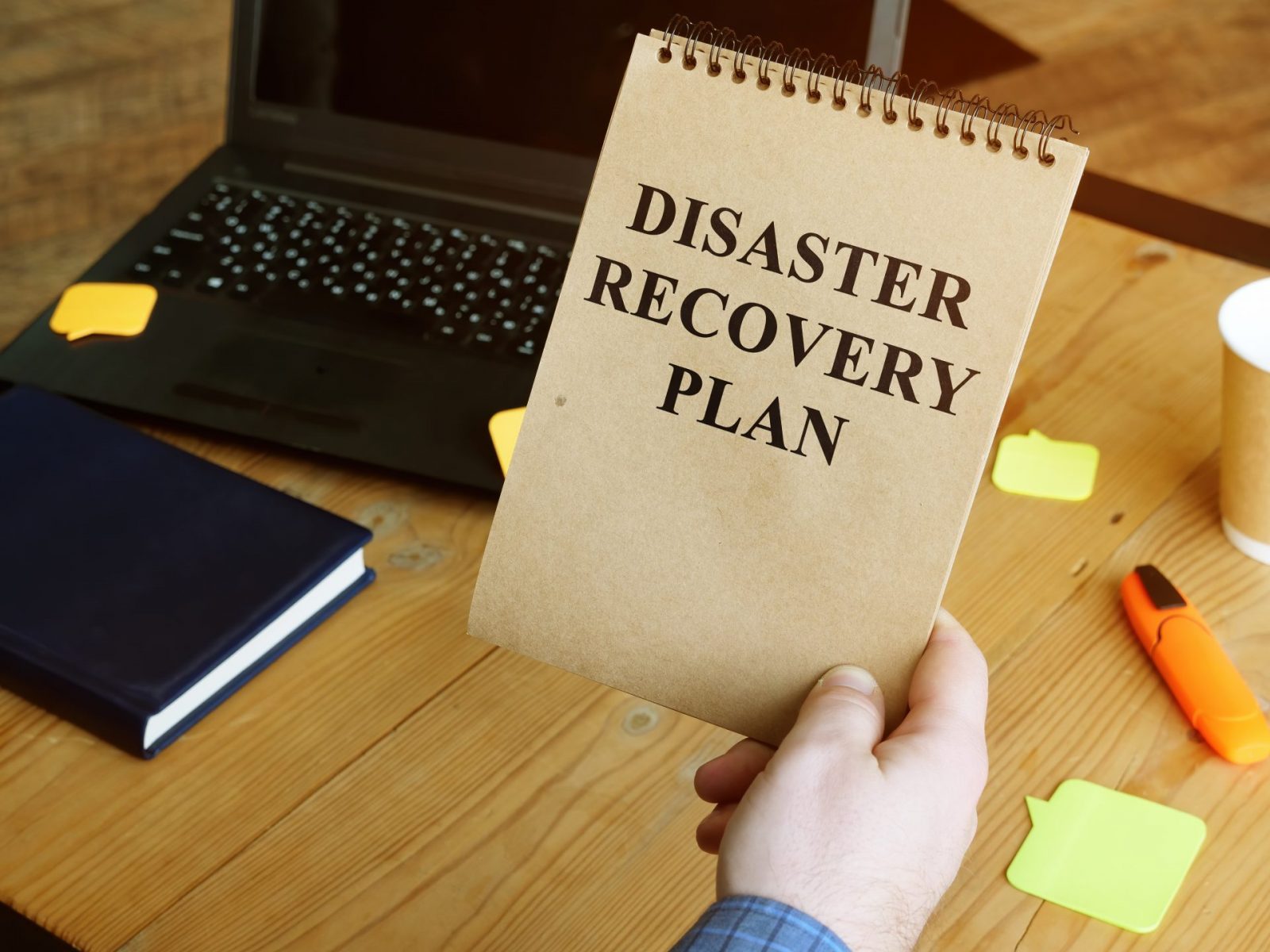 Disaster Recovery Plan in the man hands.